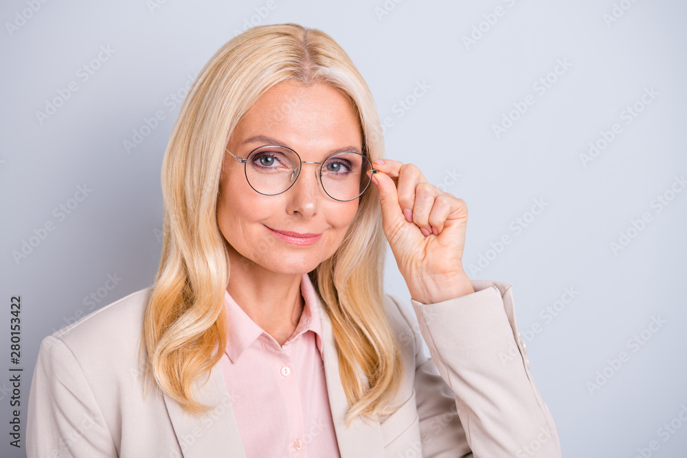 Close-up portrait of her she nice attractive stylish content cheerful peaceful wavy-haired lady specialist shark executive director touching specs isolated on light white gray pastel background Close-up portrait of her she nice attractive stylish content cheerful peaceful wavy-haired lady specialist shark executive director touching specs isolated on light white gray pastel background