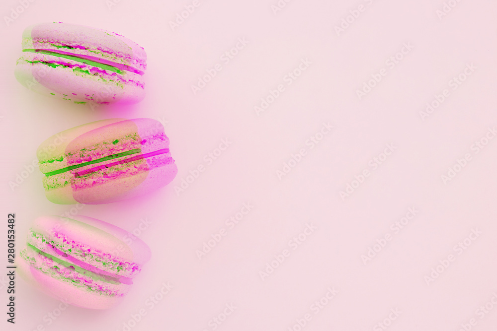 Glitch effect and desserts. Pink and green macaroons with glitch effect on a flat lay. Place for text. Horizontal image. Glitch effect and desserts. Pink and green macaroons with glitch effect on a flat lay. Place for text. Horizontal image.
