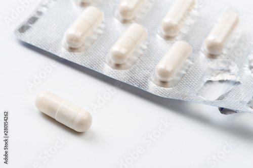 Pile of white capsules probiotic powder inside. Copy space. High resolution product. Health care concept - Image