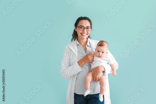 Pediatrician with cute litt...