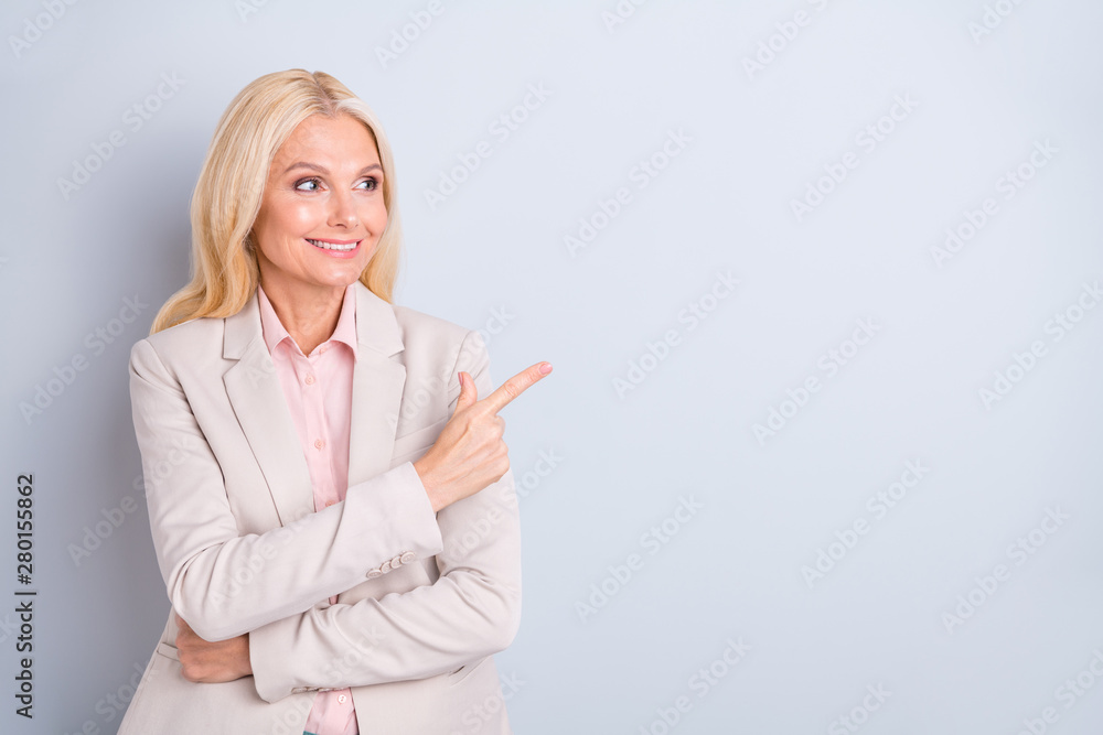 Portrait of her she nice attractive classy successful confident cheerful gray-haired businesslady showing aside copy space ad advert new product isolated over light white gray pastel background Portrait of her she nice attractive classy successful confident cheerful gray-haired businesslady showing aside copy space ad advert new product isolated over light white gray pastel background