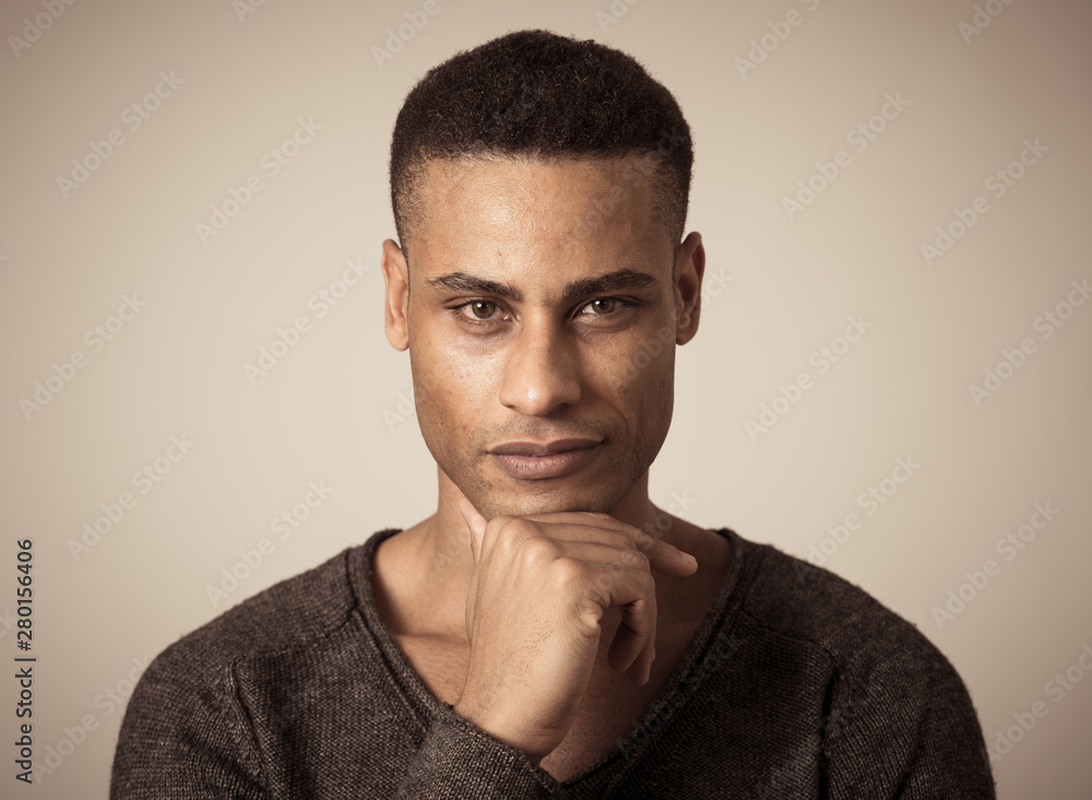 Fashion portrait of Attractive african american male model posing happy and sexy for the camera Fashion portrait of Attractive african american male model posing happy and sexy for the camera