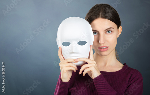 Portrait of nice lady with mask. Woman emotions and mood concept photo