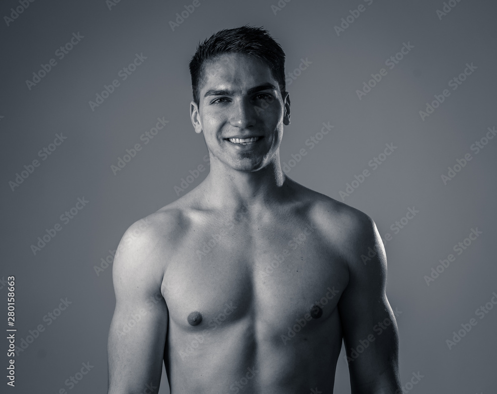 Fototapeta premium Portrait of strong healthy handsome Athletic man isolated on neutral background