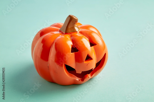 One Halloween Pumpkin on pastel blue background