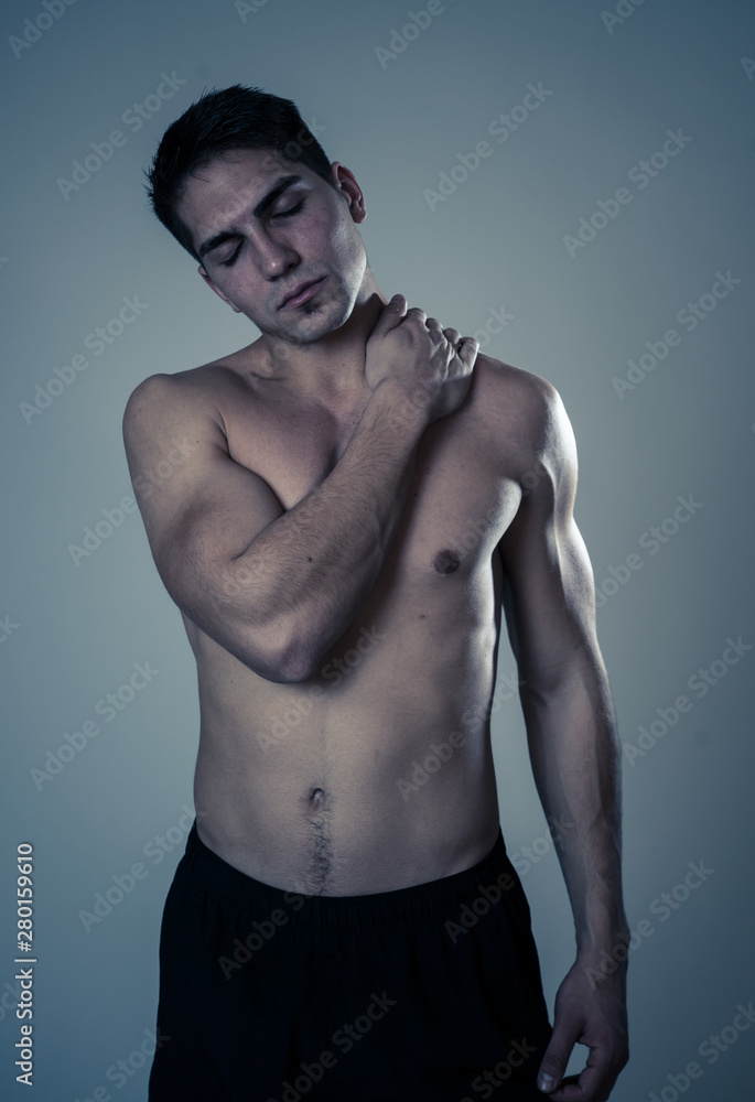 Fototapeta premium Strong young man suffering neck and cervical pain