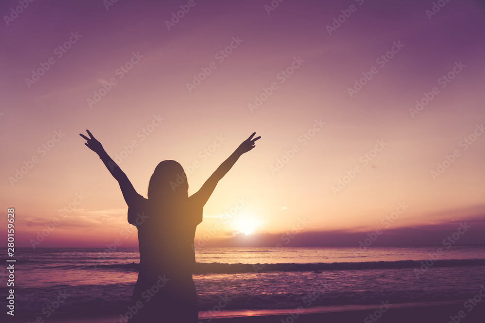 Woman rise hands up to sky freedom concept with blue sky.