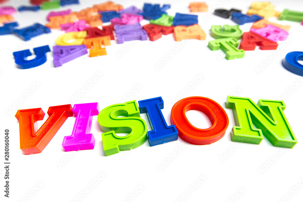 Heap of plastic colored alphabet letters close up. Vision Heap of plastic colored alphabet letters close up. Vision