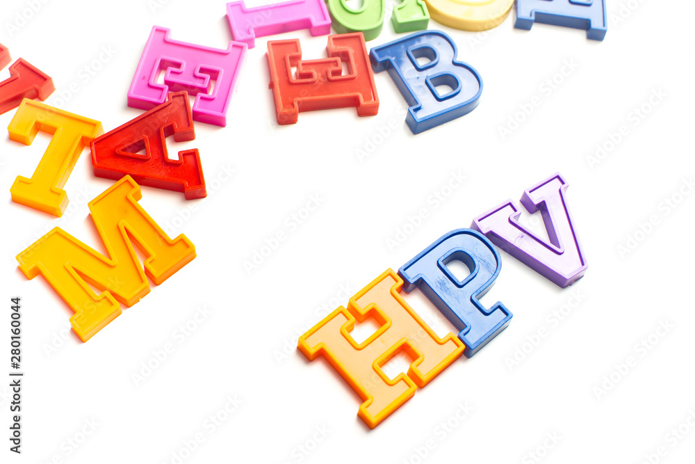 Obraz premium Heap of plastic colored alphabet letters close up. HPV