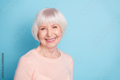 Close-up portrait of her she nice-looking attractive lovely kind healthy well-groomed cheerful cheery glad gray-haired lady enjoying spring isolated over bright vivid shine blue green teal background
