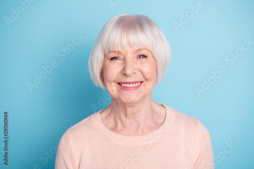 Close-up portrait of her she nice-looking attractive well-groomed content confident cheerful cheery healthy gray-haired lady isolated over bright vivid shine blue green teal background photo