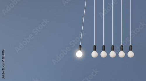 Mock up of hanging light bulbs with one glowing on blue wall background,Conceptual idea of pendulum,Outstanding. 3D rendering photo