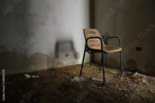 Spooky chair at the lost place Argentiera, in Sardinia (Italy) photo