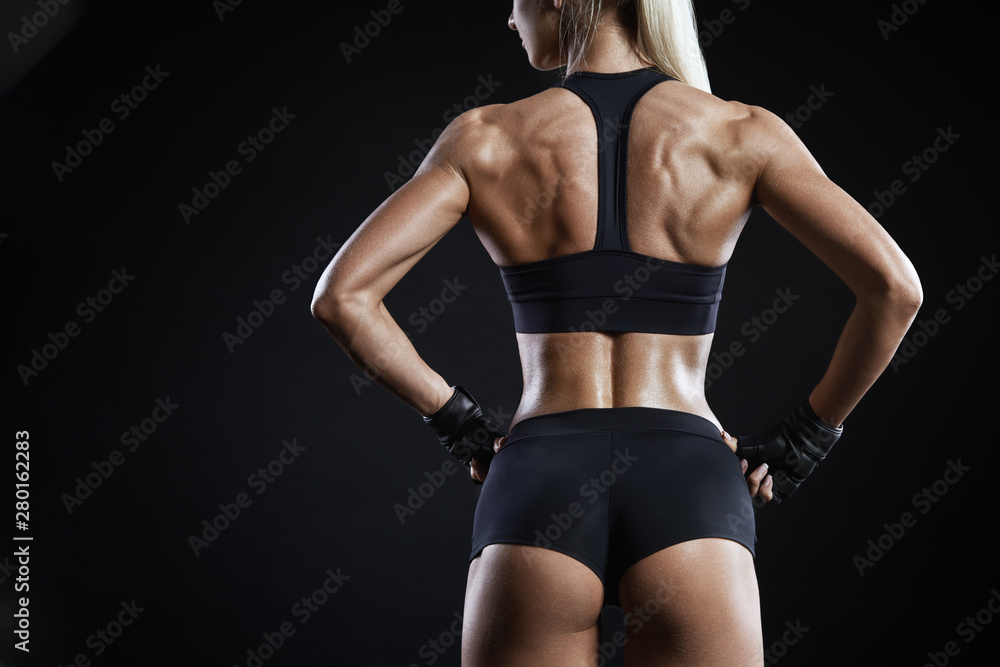 Close-up shot of back of female fitness model Close-up shot of back of female fitness model
