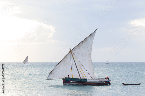 traditional dhow sailing boat transporting commodities between the islands and the mainland