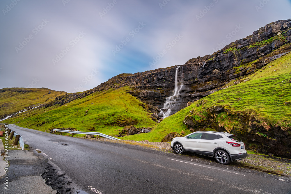 Ultra long exposure of road, car and waterfall