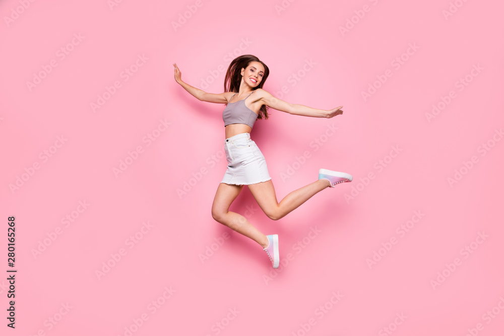 Full body photo of pretty lady raising hands looking with toothy smile isolated over pink background