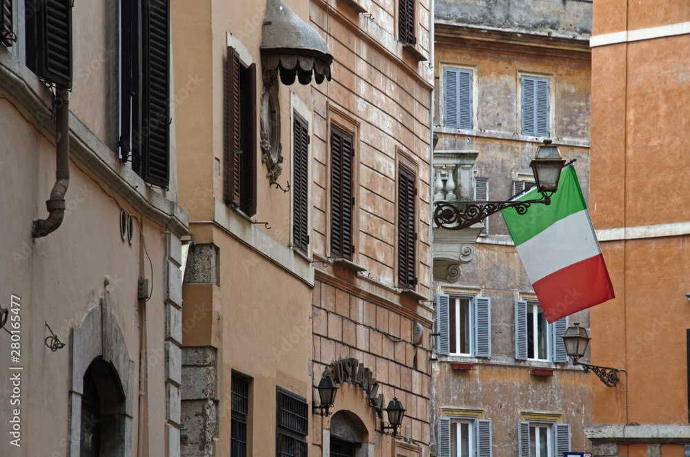 Italian flag at Piazza del Paradiso, the piazza takes its name from one of the oldest medieval inns in Rome Italy