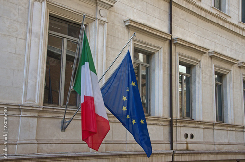 Italian and European union flags at Via della Conciliazione, the street connects Largo Giovanni XXIII to Piazza Pio XII, in front of Piazza San Pietro, Rome