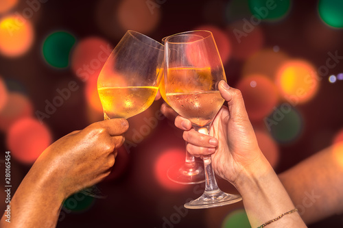 Close up of ladies hands doing a toast in the party in a club