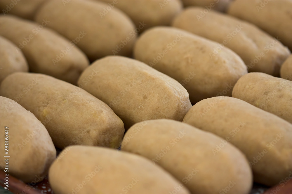 Raw big dumplings made from grated potatoes, Cepelinai Raw big dumplings made from grated potatoes, Cepelinai