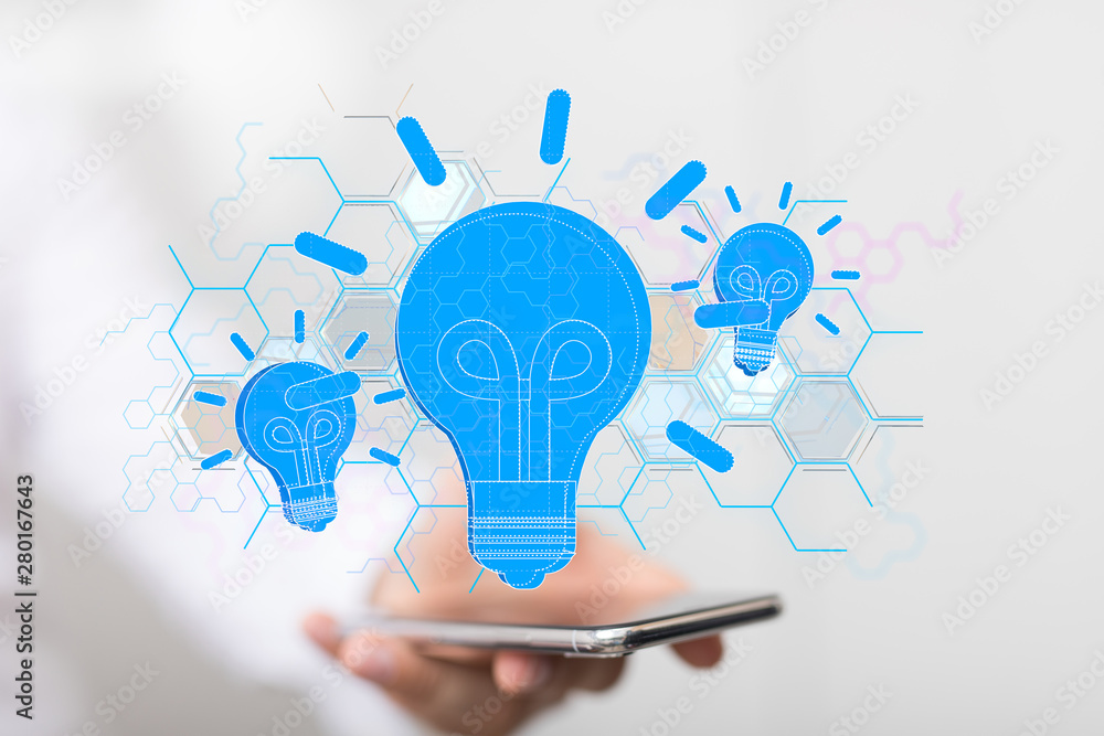 holding illuminated light bulb, idea, innovation and inspiration concept. holding illuminated light bulb, idea, innovation and inspiration concept.