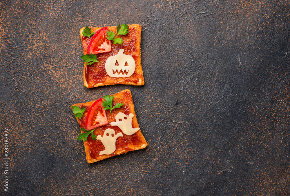 Halloween sandwiches toasts with ghost and pumpkin