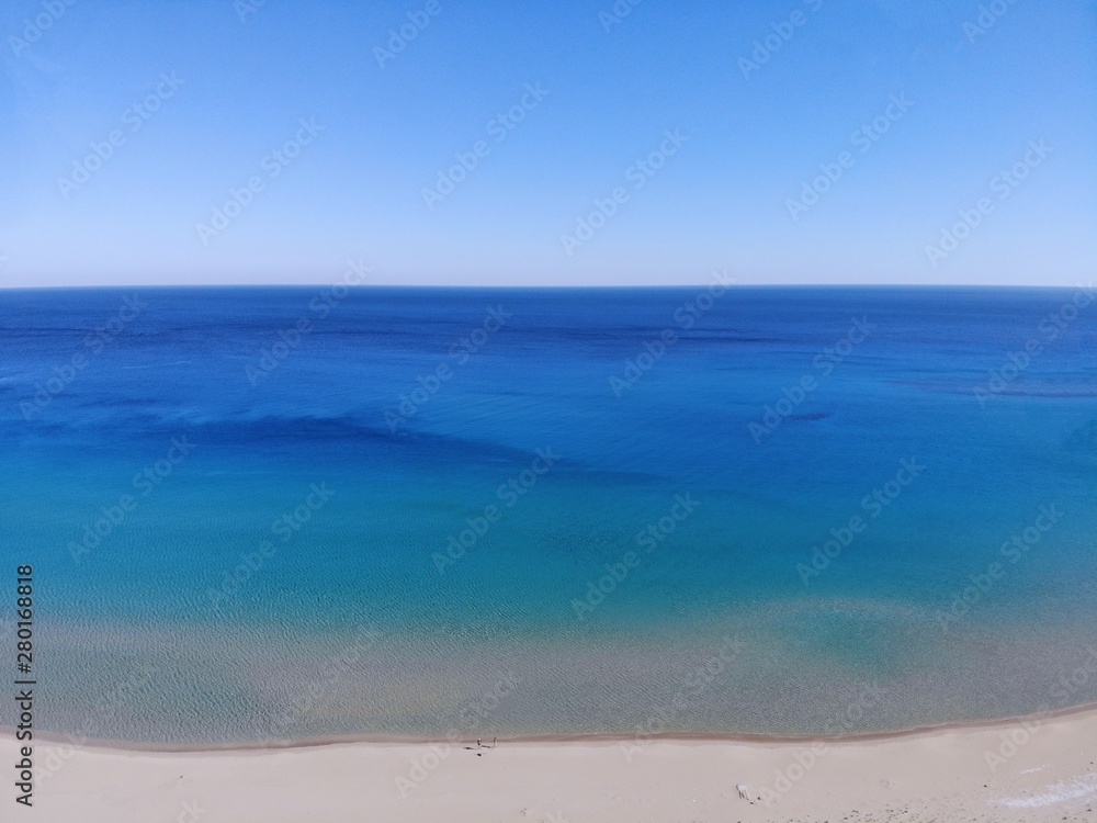 Fototapeta premium Swimming on the sea. Summertime holiday, happy moment in unity with nature. Amazing view from above. North part of Cyprus, Girne.