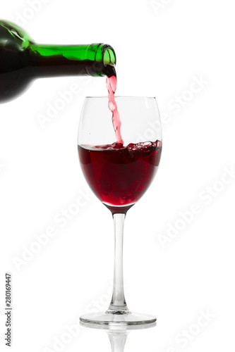 Pouring Red Wine. Isolated with clipping path. 