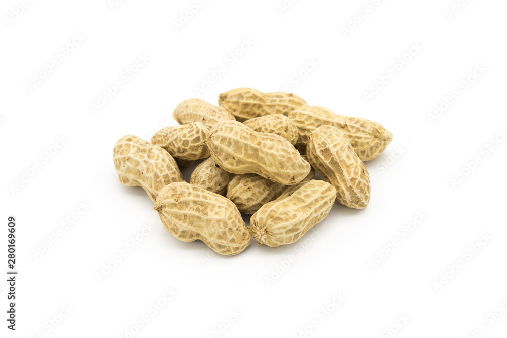Stacked fresh shelled peanuts close-up on a white background Stacked fresh shelled peanuts close-up on a white background