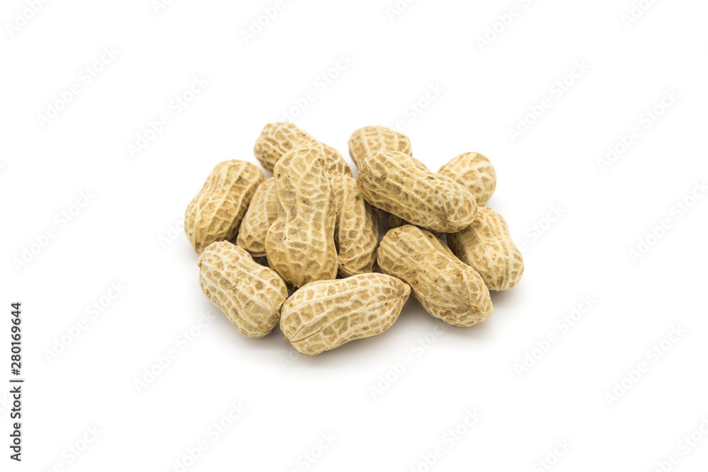 Stacked fresh shelled peanuts close-up on a white background Stacked fresh shelled peanuts close-up on a white background