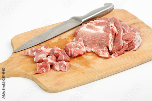 raw meat on a chopping board isolated on white
