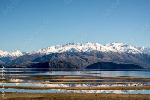 Stunning nature scenery of a beautiful lake nestled under the Southern Alps in New Zealand