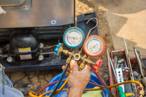 Принти на полотні repair refrigerator job with pressure gauge , technician vacuum system refrigerator at maintenance shop