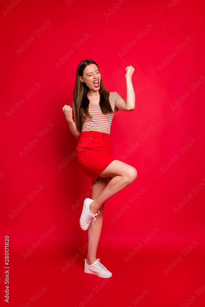 Vertical photo of yelling lady cheerleader wear casual outfit isolated burgundy background Vertical photo of yelling lady cheerleader wear casual outfit isolated burgundy background