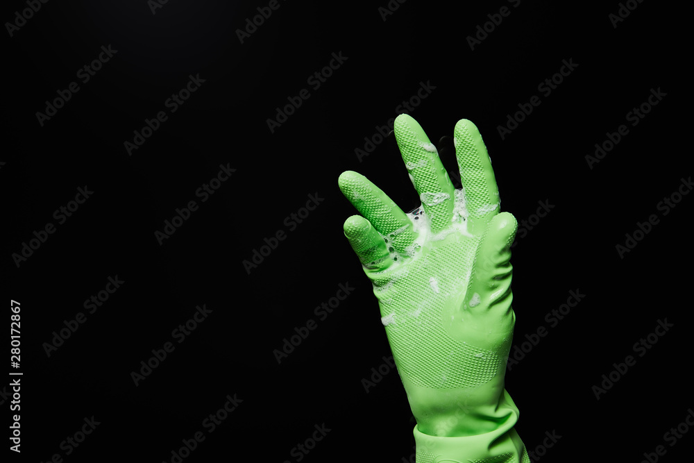 cropped view of man in rubber glove with foam isolated on black cropped view of man in rubber glove with foam isolated on black
