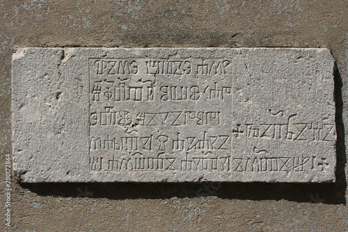 Krk island, Croatia, glagolitic inscriptions in the stone, historical croatian alphabet photo