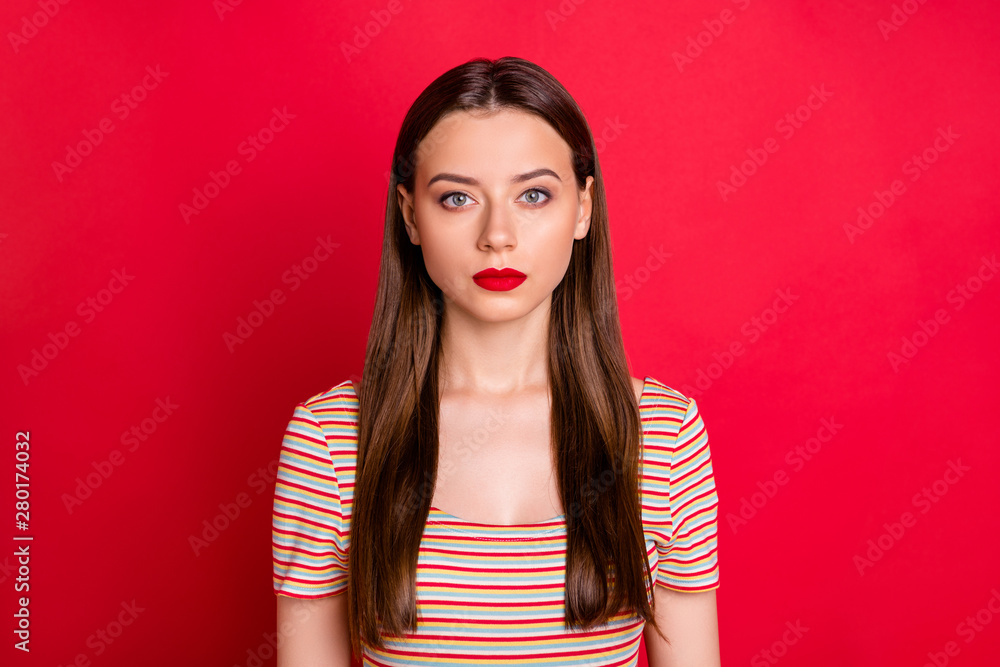 Closeup photo of pretty not smiling lady wear casual outfit isolated burgundy background Closeup photo of pretty not smiling lady wear casual outfit isolated burgundy background