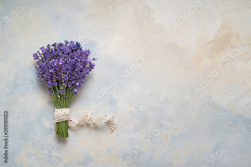 Fototapeta Naklejka Na Ścianę i Meble -  Lavender flowers bouquet on colorful background. Copy space, top view. Summer background