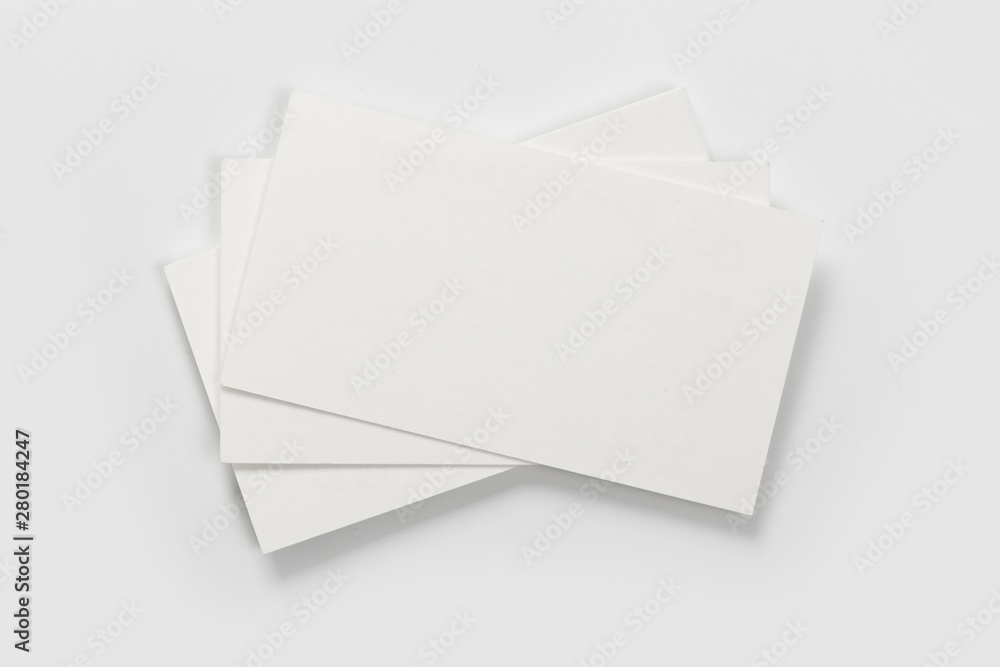 Mockup of business cards stack at white textured background. Design concept. Template for branding identity. Mockup of business cards stack at white textured background. Design concept. Template for branding identity.