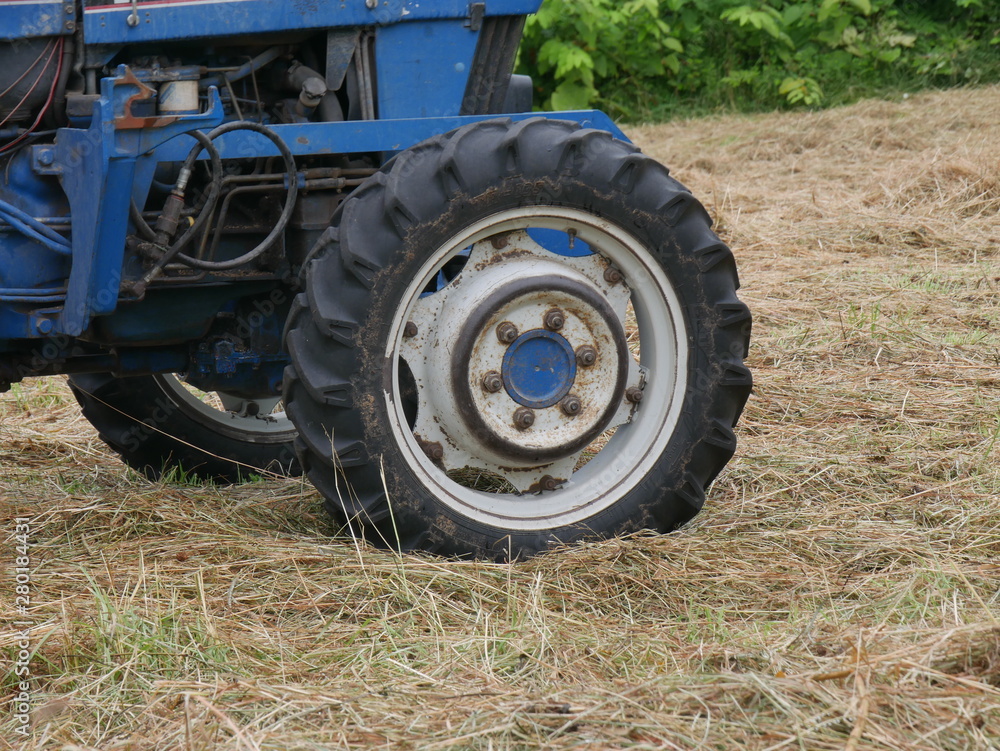 old tractor in a field old tractor in a field