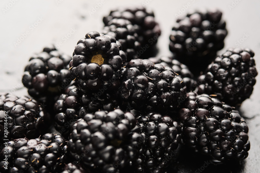 Close-up of delicious fresh blackberries with water drops. Close-up of delicious fresh blackberries with water drops.