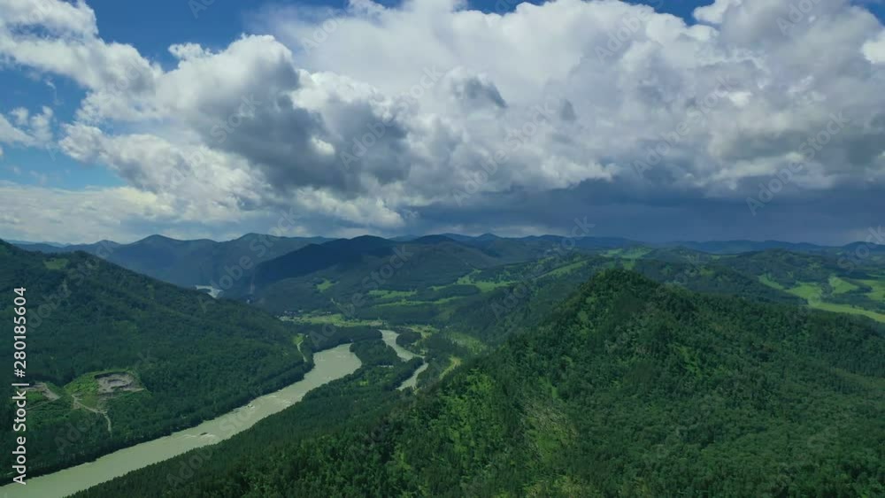 Aerial view, flying over the Katun River valley in the Altai mountains during summer, Russia. Aerial view, flying over the Katun River valley in the Altai mountains during summer, Russia.