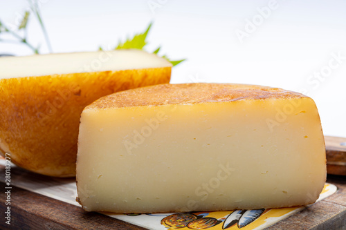 Hard Italian pecorino sheep cheese in two pieces