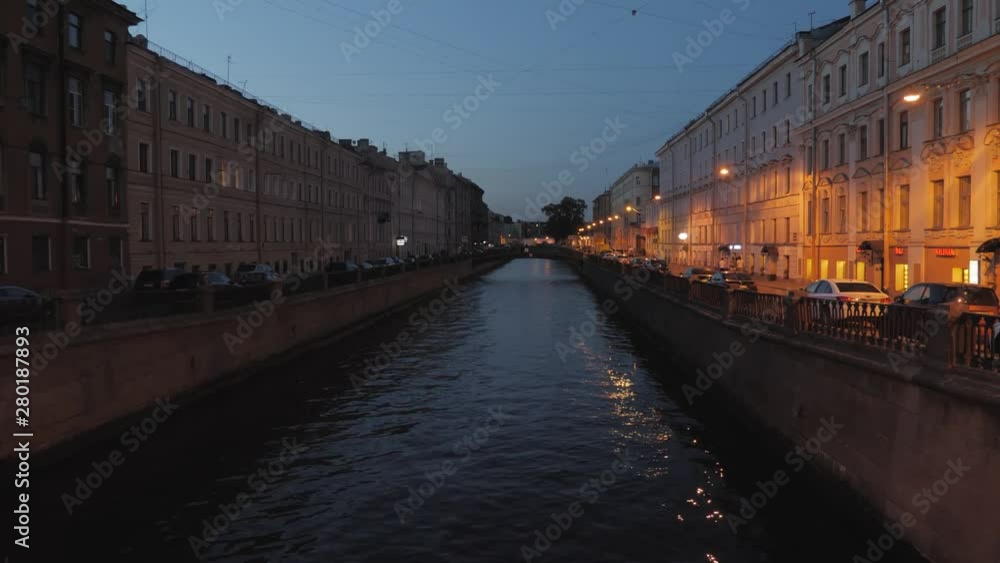 View of Neva river in St. Petersburg, Russia. Tourist boats float on the river. Buildings near the Neva River Embankment. View of Neva river in St. Petersburg, Russia. Tourist boats float on the river. Buildings near the Neva River Embankment.