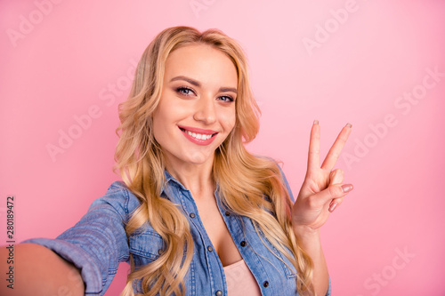 Closeup photo of pretty lady making selfies showing v-sign symbol wear denim outfit isolated pink background