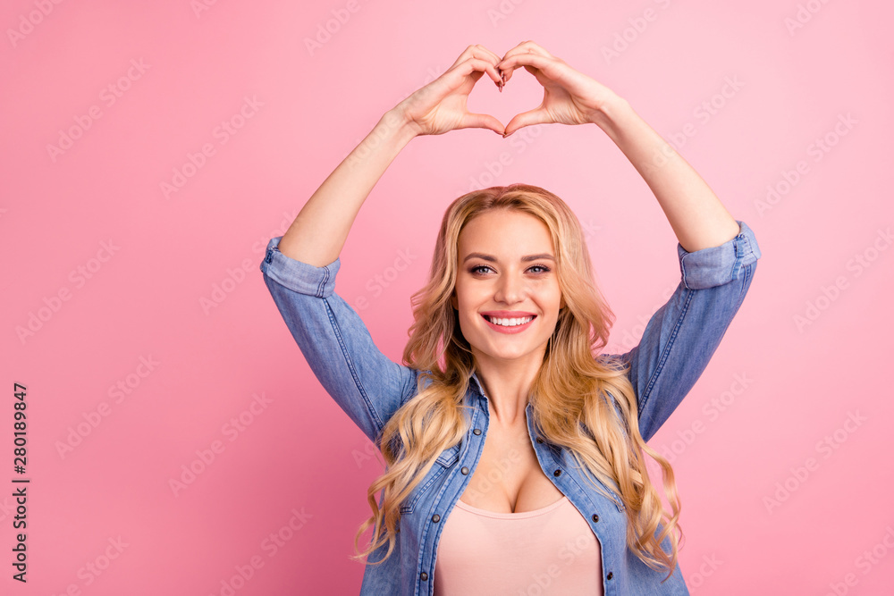 Closeup photo of pretty lady holding hands in heart shape above head wear denim outfit isolated pink background Closeup photo of pretty lady holding hands in heart shape above head wear denim outfit isolated pink background