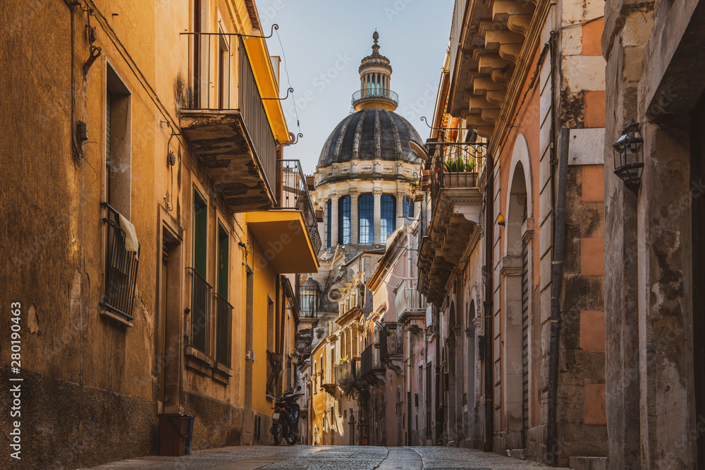Fototapeta Scenic view of the baroque sicilian town Ragusa Ibla and St. George's Cathedral dome in Sicily, Italy
