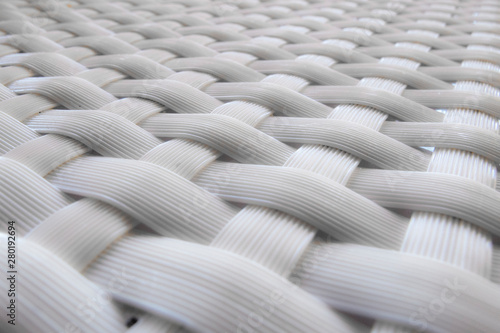 still life: detail of white woven seat, abstract background