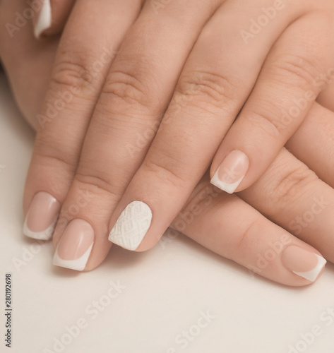 hands of woman with manicured nails white